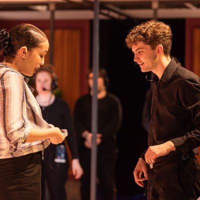 students working with actors on set